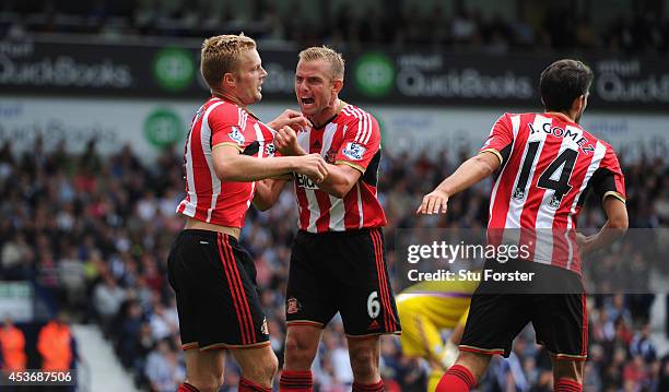 Sunderland player Lee Cattermole congratulates Seb Larsson after Larsson had score the second goal during the Barclays Premier League match between...