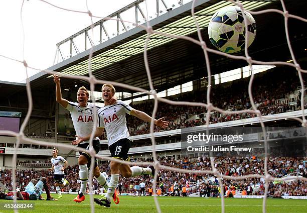 Eric Dier of Spurs celebrates with teammate Harry Kane after scoring the match winning goal during the Barclays Premier League match between West Ham...