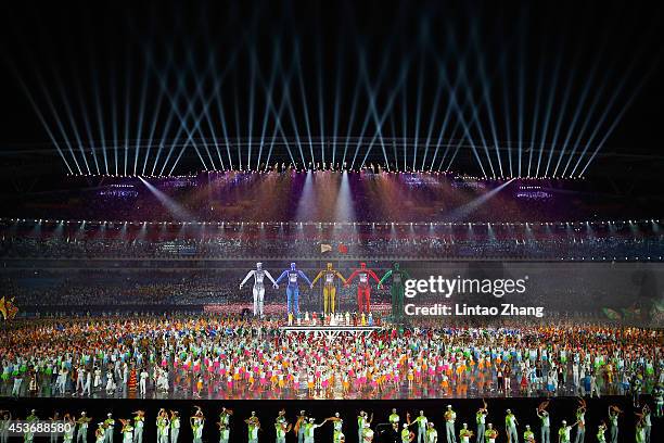 Dancers perform during the opening ceremony for the Nanjing 2014 Summer Youth Olympic Games at the Nanjing Olympic Sports Centre on August 16, 2014...