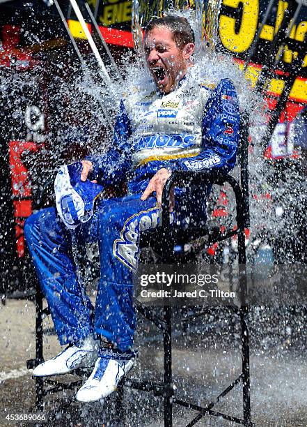 Brian Vickers, driver of the Aaron's Dream Machine Toyota, participates in the ALS Ice Bucket Challenge after practice for the NASCAR Sprint Cup...