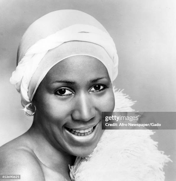 African American singer Aretha Franklin smiles for her headshot, January 4, 1978.