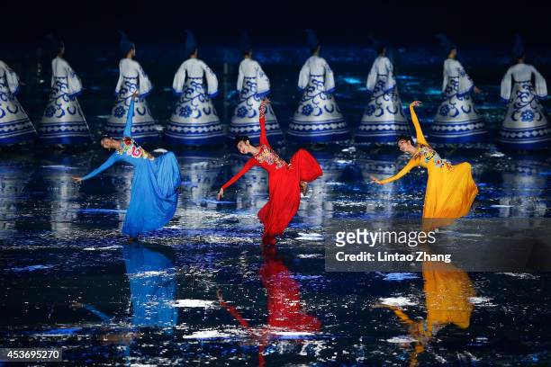 Dancers perform during the opening ceremony for the Nanjing 2014 Summer Youth Olympic Games at the Nanjing Olympic Sports Centre on August 16, 2014...
