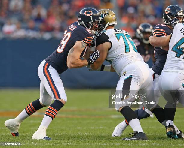 Jared Allen of the Chicago Bears rushes against Luke Joeckel of the Jacksonville Jaguars during a preseason game at Soldier Field on August 14, 2014...