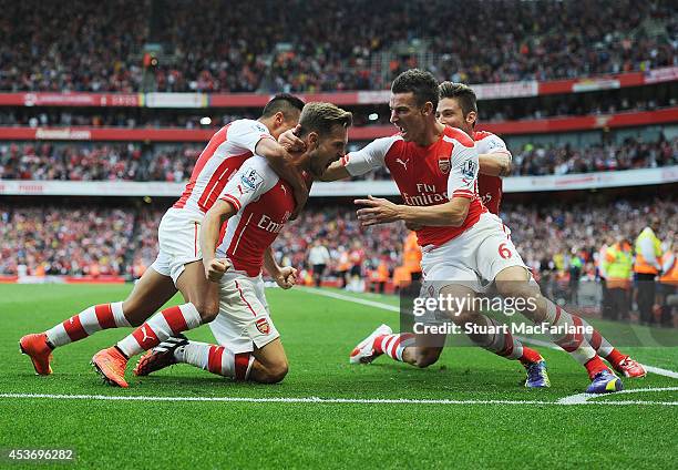 Aaron Ramsey of Arsenal celebrates scoring their 2nd goal with Alexis Sanchez and Laurent Koscielny and Mikel Arteta during the Barclays Premier...