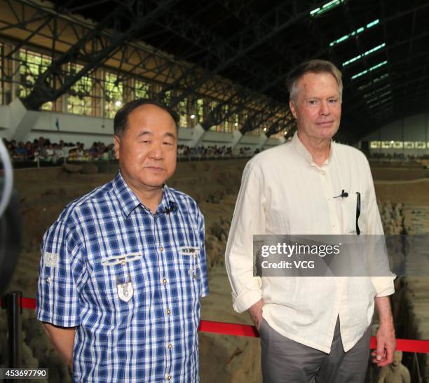 XI AN, CHINA - AUGUST 16: (CHINA OUT) French Literature Nobel laureate Jean-Marie Gustave Le Clezio (R) and Chinese Literature Nobel laureate Mo Yan visit the terra-cotta warriors on August 16, 2014 in Xi'an, Shannxi Province of China. French Literature Nobel laureate Jean-Marie Gustave Le Clezio and Chinese Literature Nobel laureate Mo Yan will attend a dialogue with the theme of "Chang'an and the Silk road" on August 17 in Xi'an. (Photo by Visual China Group via Getty Images/Visual China Group via Getty Images) xi an china china out french