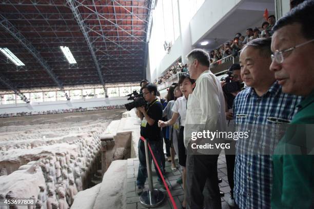 XI AN, CHINA - AUGUST 16: (CHINA OUT) French Literature Nobel laureate Jean-Marie Gustave Le Clezio (R3) and Chinese Literature Nobel laureate Mo Yan (R2) visit the terra-cotta warriors on August 16, 2014 in Xi'an, Shannxi Province of China. French Literature Nobel laureate Jean-Marie Gustave Le Clezio and Chinese Literature Nobel laureate Mo Yan will attend a dialogue with the theme of "Chang'an and the Silk road" on August 17 in Xi'an. (Photo by Visual China Group via Getty Images/Visual China Group via Getty Images) xi an china china out french