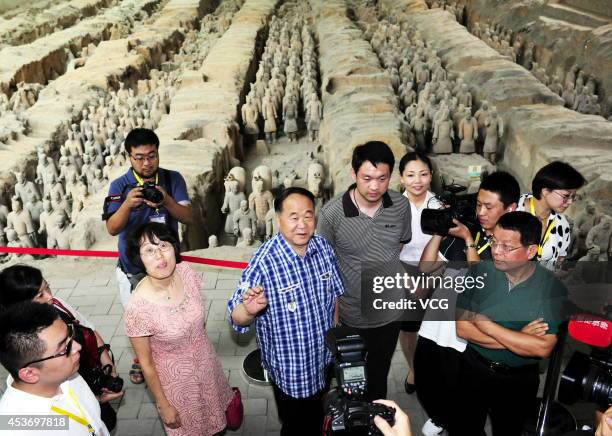 XI AN, CHINA - AUGUST 16: (CHINA OUT) Chinese Literature Nobel laureate Mo Yan visits the terra-cotta warriors on August 16, 2014 in Xi'an, Shannxi Province of China. French Literature Nobel laureate Jean-Marie Gustave Le Clezio and Chinese Literature Nobel laureate Mo Yan will attend a dialogue with the theme of "Chang'an and the Silk road" on August 17 in Xi'an. (Photo by Visual China Group via Getty Images/Visual China Group via Getty Images) xi an china china out chinese