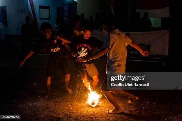 24 Locals Gather For A Game Of Fire Football Ahead Of Independence Day  Celebrations Stock Photos, High-Res Pictures, and Images - Getty Images