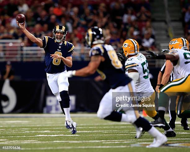 Quarterback Sam Bradford of the St. Louis Rams passes to Lance Kendricks during the preseason game against the Green Bay Packers at Edward Jones Dome...