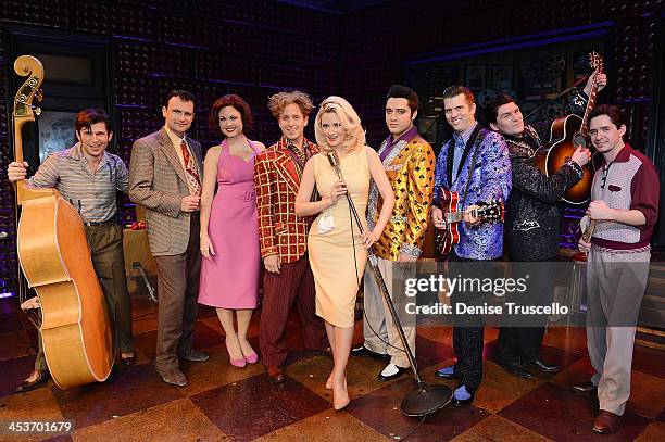 Holly Madison poses for photos with The Million Dollar Quartet cast members Mikey Hachey, Marc D. Donovan, Felice Garcia, Martin Kaye, Justin...