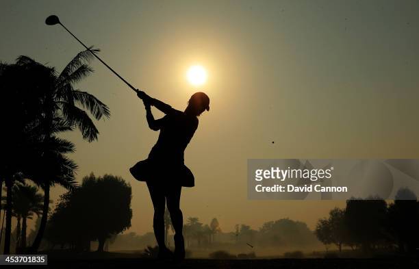 Melodie Bourdy of France plays her tee shot at the par 5, 10th hole during the second round of the 2013 Omega Dubai Ladies Masters on the Majilis...