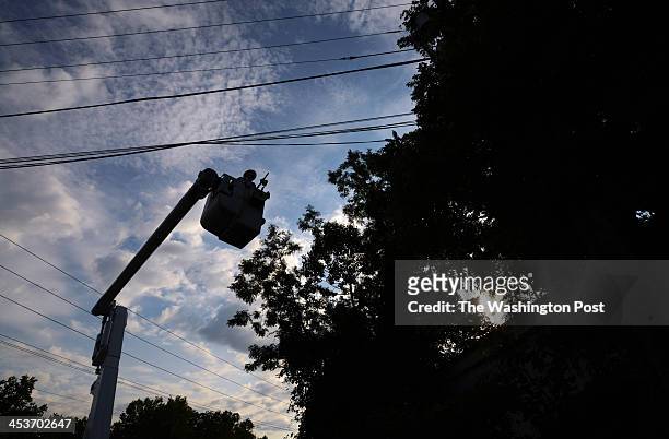 Pepco employee, James Tarantella works on fixing a blown fuse on a power outage call on Monday August 13, 2012 in Rockville, MD. Pepco has been...
