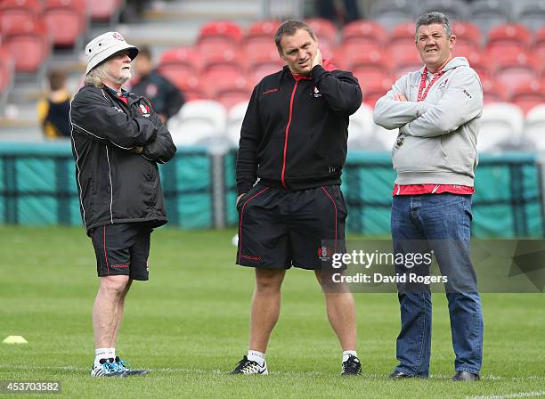Laurie Fisher, the Gloucester head coach, looks on with scrum coach Trevor Woodman and defence coach John Muggleton during the pre season friendly...