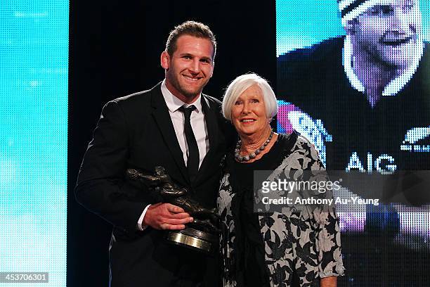 All Black Kieran Read is presented with the Kelvin R Tremain Memorial Player of the Year award from Pam Tremain during the 2013 Steinlager Rugby...