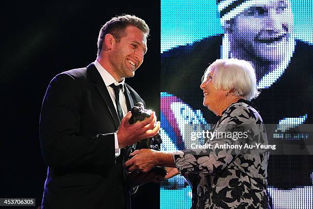 All Black Kieran Read is presented with the Kelvin R Tremain Memorial Player of the Year award from Pam Tremain during the 2013 Steinlager Rugby...