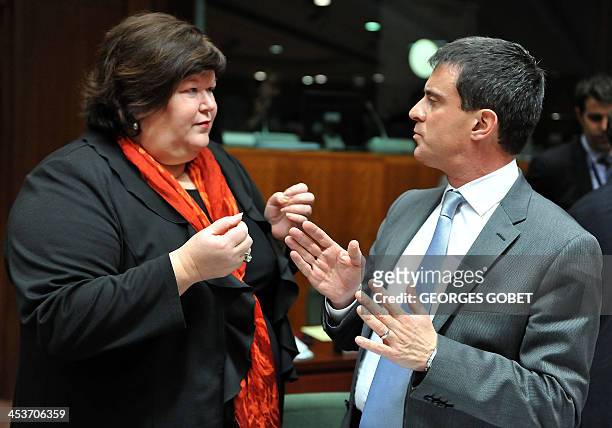 Belgian State Secretary for Home Affairs Maggie De Block speaks with French Interior minister Manuel Valls prior to a Justice and Home Affairs...