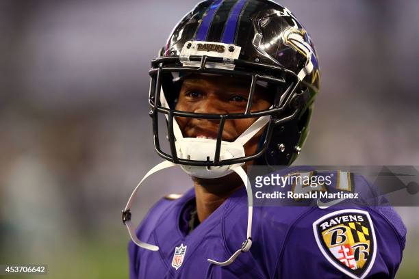 Ray Rice of the Baltimore Ravens smiles during warm ups before their game against the Dallas Cowboys at AT&T Stadium on August 16, 2014 in Arlington,...