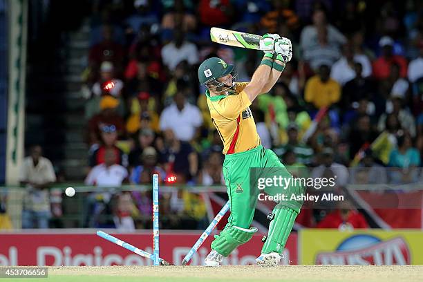 Martin Guptill of the Guyana Amazon Warriors gets his stumps shattered during the Limacol Caribbean Premier League 2014 final match between Guyana...