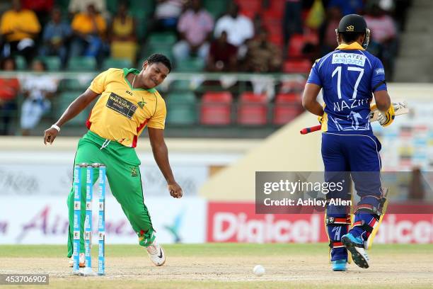 Krishmar Santokie of Guyana Amazon Warriors celebrates the wicket of William Perkins during the Limacol Caribbean Premier League 2014 final match...