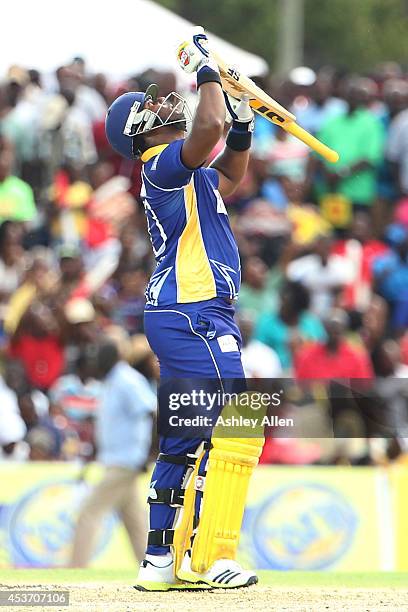 Dwayne Smith celebrates reaching his 50 during the Limacol Caribbean Premier League 2014 final match between Guyana Amazon Warriors and Barbados...