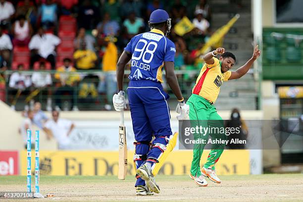 Guyana Amazon Warriors bowler Krishmar Santokie celebrates the wicket of Jason Holder during the Limacol Caribbean Premier League 2014 final match...