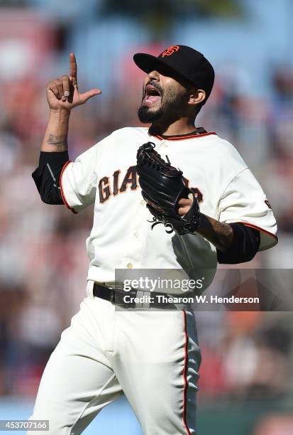 Sergio Romo of the San Francisco Giants celebrates after defeating the Philadelphia Phillies 6-5 at AT&T Park on August 16, 2014 in San Francisco,...