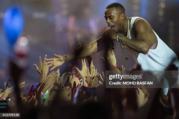 In a photo taken on August 16 US hip hop artist B.O.B performs on stage at the MTV World Stage Live in Malaysia 2014 concert at the Sunway Lagoon in...