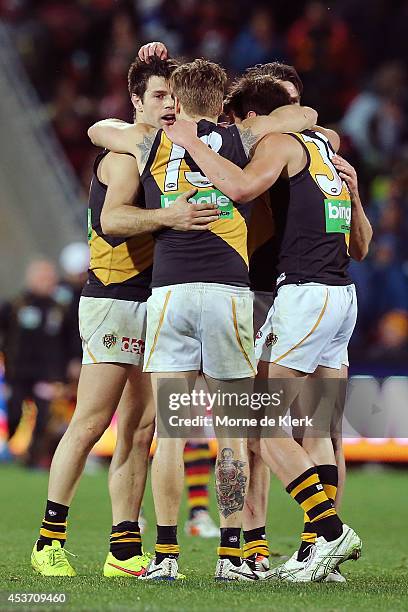 Tigers players celebrate after winning the round 21 AFL match between the Adelaide Crows and the Richmond Tigers at Adelaide Oval on August 16, 2014...