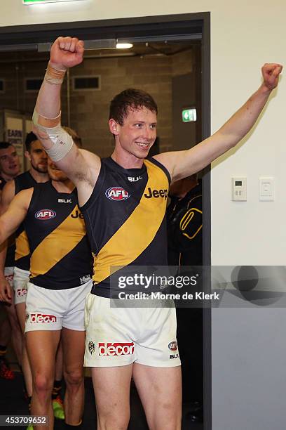 Tigers players celebrate after winning the round 21 AFL match between the Adelaide Crows and the Richmond Tigers at Adelaide Oval on August 16, 2014...