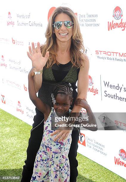Jillian Michaels and daughter Lukensia Michaels Rhoades arrive at The Dave Thomas Foundation for adoption's kickball for a home celebrity kickball...