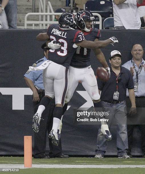 William Powell of the Houston Texans celebrates with DeVier Posey of the Houston Texans punt return from a touchdown in the fourth quarter in a...