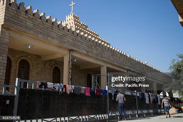 Laundry is hanging to dry at Saint Joseph Church. 650 Christian Kurdish families have taken shelter inside Saint Joseph Church, after an...