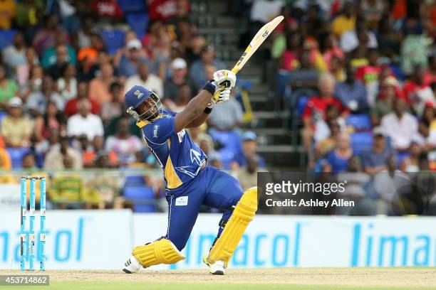 Dwayne Smith on the attack during the Limacol Caribbean Premier League 2014 final match between Guyana Amazon Warriors and Barbados Tridents at...