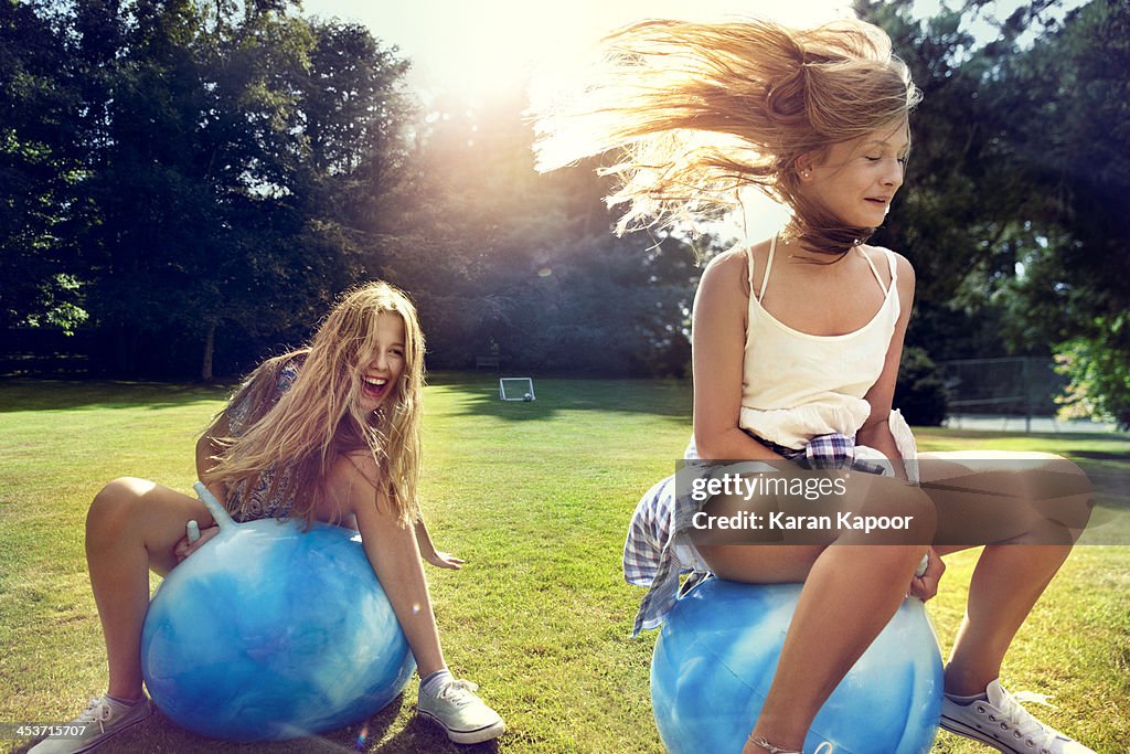 Teenage girls on Space Hopper