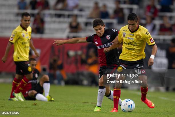 Alfonso Gonzalez of Atlas fights for the ball with Daniel Cano of UdG during a match between Atlas and Leones Negros as part of 5th round Apertura...