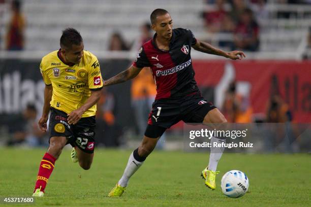 Edgar Castillo of Atlas fights for the ball with Efren Mendoza of UdG during a match between Atlas and Leones Negros as part of 5th round Apertura...