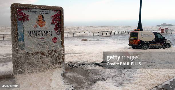 The tide turns to froth by the Lifeboat Station on the promenade in Blackpool, north west England, on December 5, 2013 as high winds hit the north of...