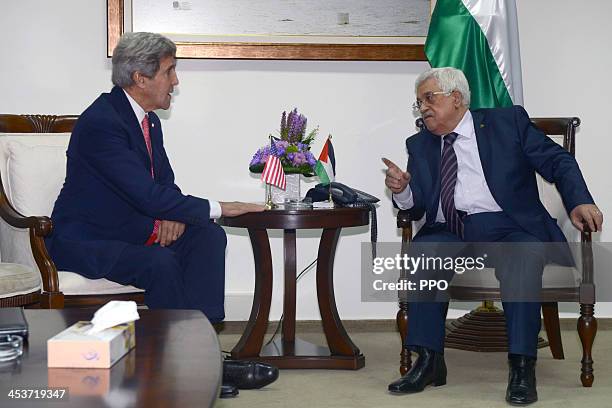 In this handout image supplied by the Palestinian Press Office , Palestinian President Mahmoud Abbas holds a meeting with US Secretary Of State John...