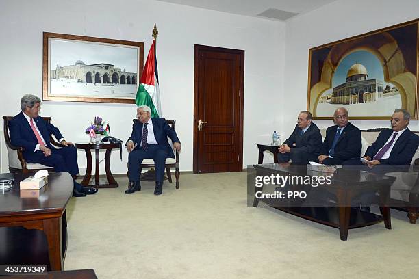 In this handout image supplied by the Palestinian Press Office , Palestinian President Mahmoud Abbas holds a meeting with US Secretary Of State John...