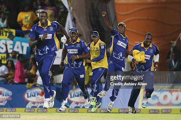 Barbados Tridents players Jason Holder, Dwayne Smith, Shane Dowrich, Akeal Hosien and Ashley Nurse celebrate victory over the Amazon Warriors during...
