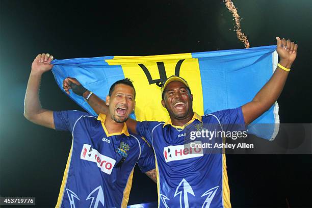 Barbados Tridents teammates Rayad Emrit and Dwayne Smith celebrate after winning the Limacol Caribbean Premier League 2014 final match between Guyana...