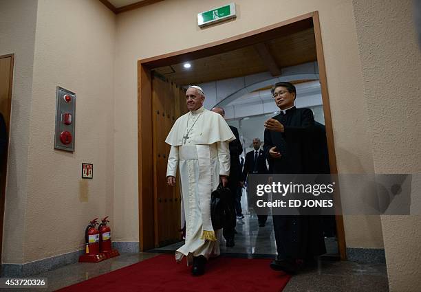 Pope Francis arrives for a meeting with Catholic bishops from 22 Asian countries at Haemi Martyrs Shrine in Haemi, south of Seoul on August 17 on the...