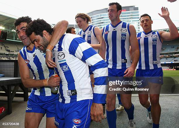 Lindsay Thomas and Daniel Wells of the Kangaroos celebrate winning the round 21 AFL match between the North Melbourne Kangaroos and the Western...