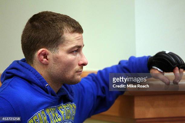 Zach Makovsky sits backstage during the UFC fight night event at the Cross Insurance Center on August 16, 2014 in Bangor, Maine.