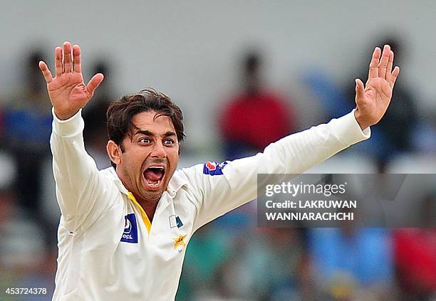 Pakistan bowler Saeed Ajmal successfully appeals for the wicket of Sri Lankan batsman Dhammika Prasad during the fourth day of the second Test match...