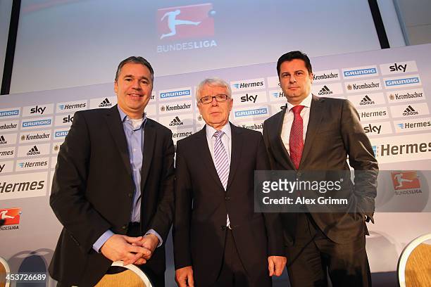 Manager Andreas Rettig, league president Reinhard Rauball and DFL executive director Christian Seifert pose after a press conference following the...