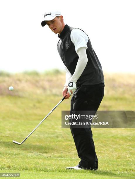 Rowan Lester of Ireland plays an approach shot in his match play final against Oskar Bergqvist of Sweden during the Boys Amateur Championship at...