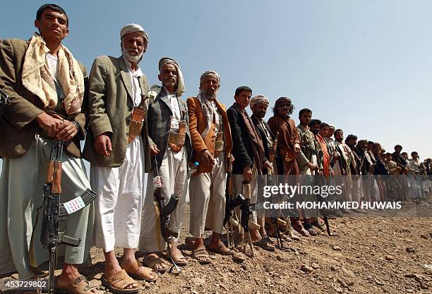 Armed Yemeni men loyal to the Shiite Huthi movement attend a tribal gathering against al-Qaeda militants in the Bani al-Harith area, on August 17,...