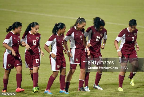 Deyna Castellanos of Venezuela leads her team-mates in dancing after scoring against Slovakia during the FIFA Girls Summer Olympic Football...