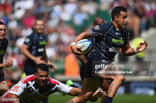 Captain Michael Palefau of Seattle gets away from Izzy Fao'l of Harlequins to score a try during the Shield Final match between Harlequins and...